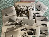 several black and white photos of people and vehicles on a bed