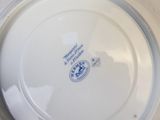 a white plate with a blue and white design on it