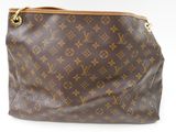 a close up of a brown louis vuitton bag on a white background