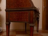 a very old piano in the middle of a room