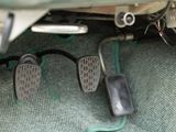 a pair of foot pedals that are attached to a car