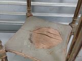 a chair that has a hole in the back of it