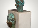 a statue of a woman ' s head on top of a block