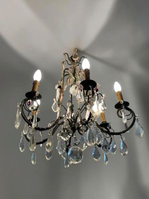 a chandelier that is hanging from the ceiling