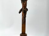 a wooden cross with a crucifix on top of it