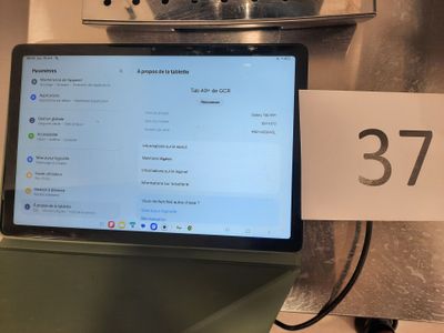 a laptop computer sitting on top of a counter