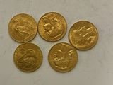 four gold sovereigns, one of which is a lion and the other of which is a horse