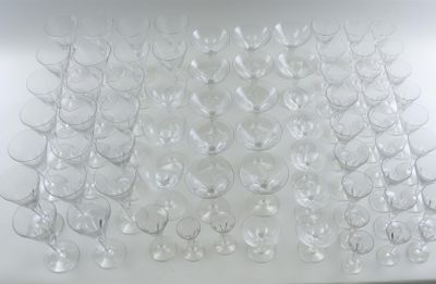 a large amount of empty wine glasses on the table