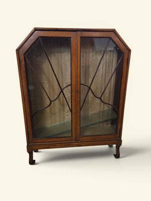 an image of a cabinet with a glass door