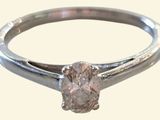 a ring with a diamond in it on a white background