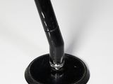 a black pipe sticking out of a hole in the floor