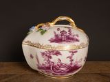 an image of a purple and white bowl on a wooden table