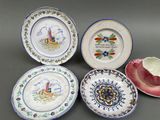several plates with designs on them are sitting on a table