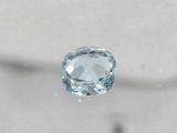 a close up of a blue topaz diamond on a white surface