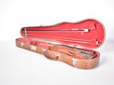 a violin case with a violin in it on a white surface