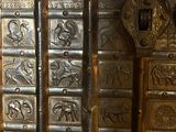 a close up of a metal door with ornate designs on it
