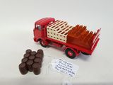 a red truck with a crate of chocolates on the back