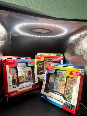 three nintendo wii games in the box on the couch