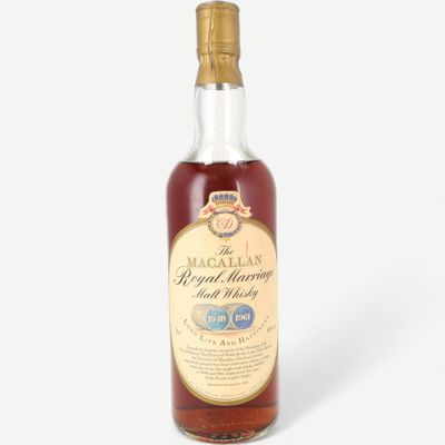 a bottle of royal reserve whisky on a white background