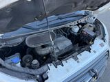 a car with its hood open and the engine in the trunk