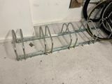 a bike that is parked next to a bike rack