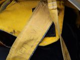 yellow firefighter helmet with a yellow ribbon and a pair of scissors