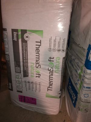 a stack of mattresses sitting on top of each other in a room