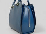a blue handbag on a white background
