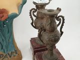 three vases that are sitting next to each other on a table