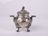 an antique silverplated teapot on stand with a lid