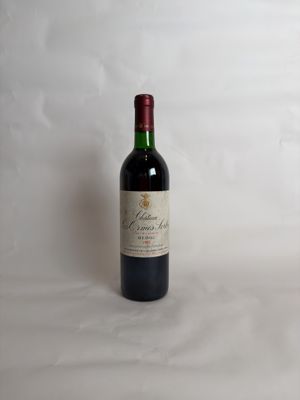 a bottle of wine that is sitting on a table
