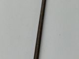 a close up of a metal object on a white surface