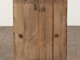 an old wooden cabinet sitting on top of a hard wood floor