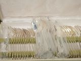 a lot of forks and spoons in a box