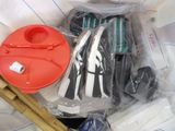 a plastic container filled with assorted items on a table