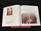 an open book with a picture of a dog and a cat on it