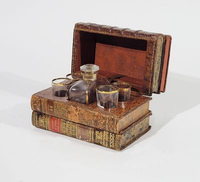 a box with a bottle and glasses on top of it