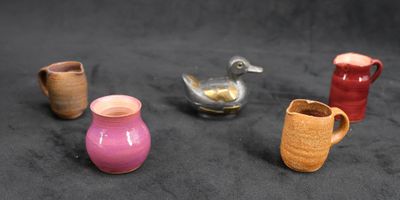 Lot comprenant trois pichets et un vase On y joint un canard…