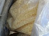a bag full of rice sitting on top of a table