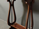 a wooden table with a harp on top of it