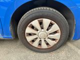 a close up of a tire on a blue car