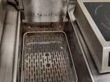 a fryer that has a frying pan in it