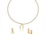 a close up of a necklace and earrings on a white background