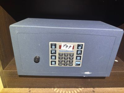 a safe box on a shelf in a room