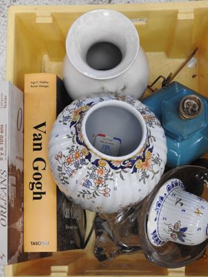 a yellow box filled with different types of vases and books