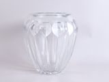 a glass vase that is sitting on a table