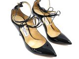 a close up of a pair of black shoes on a white background