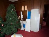 a christmas tree in the middle of a room with a christmas tree in the middle of the room