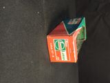 a box of toothpaste sitting on the back of a couch