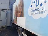 a truck that has a picture of a woman on the side of it